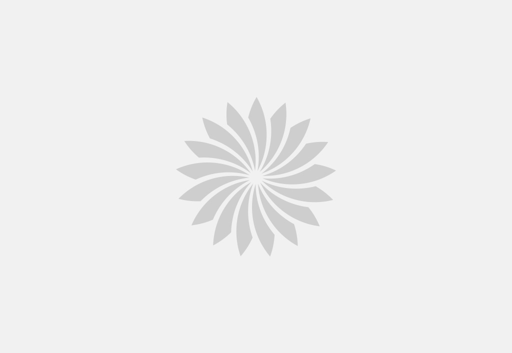 Couple dining outdoors at The Oberoi Bengaluru, under tree lights.